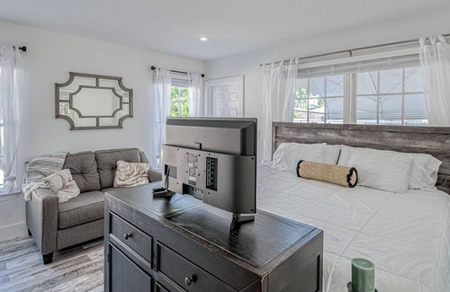 Poiciana Park II Apartment | Stylish, dog-friendly home with a pool, enclosed yard, patio, & central AC