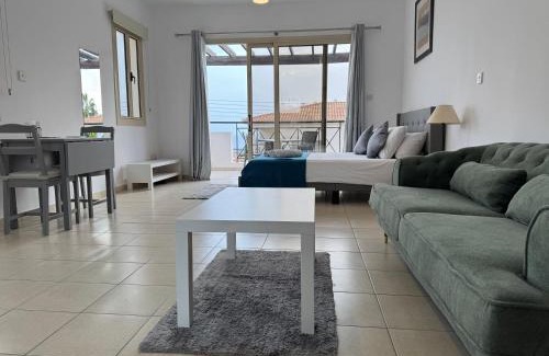 Peyia Town Apartment | Stylish Studio with Pool and Balcony Hillside and Sea Views For Business or Leisure Travellers