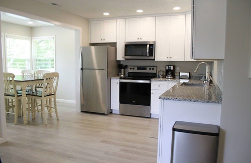 Sloans Valley Cottage | Sunny Daze Cottage 3 bedroom covered deck resort boat dock pool firepit arcade