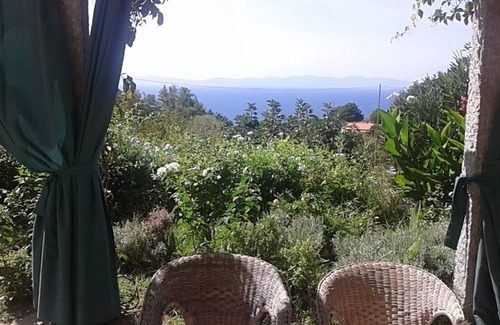 Zanca House | Sunset over Corsica. Detached house surrounded by greenery, sea view.
