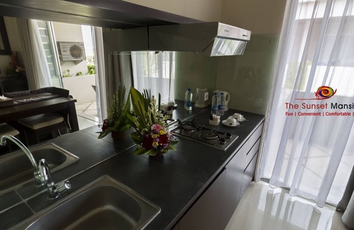 Sunset Road Apartment | Swiss-Belcourt Sunset