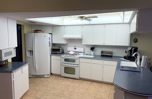Riverview House | Tampa area home with solar-heated pool, hot tub, river and large dock.