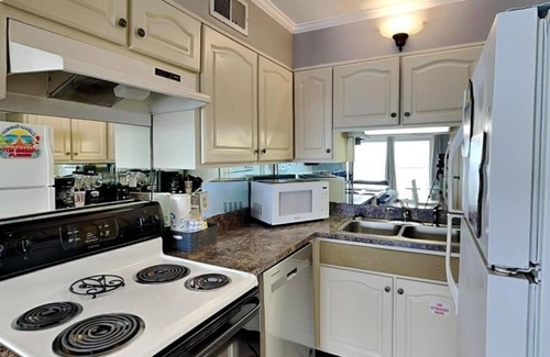 Bel Air Condo | THE BEST LOCATION & AMAZING SUNSETS~4 POOLS~TIKI BAR~KID ZONE on the Beach!