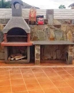 Mogan Apartment | The perfect place to relax Bedroom with hot tub, beautiful tropical garden area. Bbq and big open spaces through all the house.It is located in a quiet place, but still 5 min away from the touristic Puerto Rico and walking distance from the beach