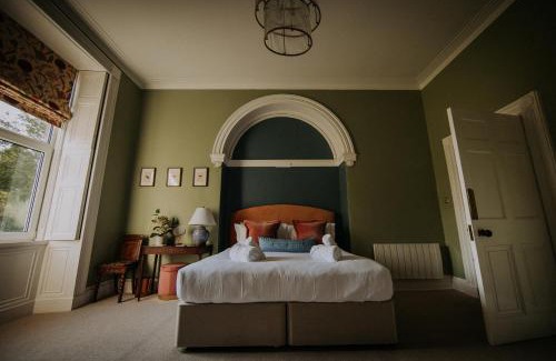 Grange-over-Sands Apartment | The Pheasant Lodge Spacious Cosy Georgian Apartment with Garden Views & Log Fire
