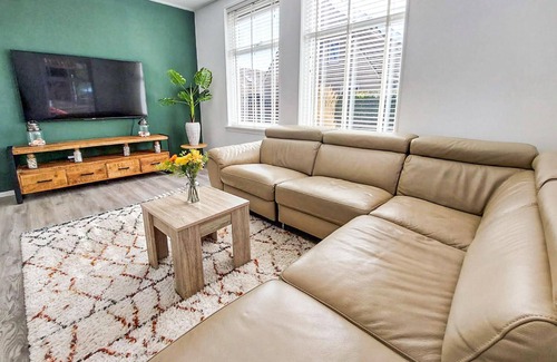 Woudsend House | This charming vacation home in Woudsend is located next to an old windmill.