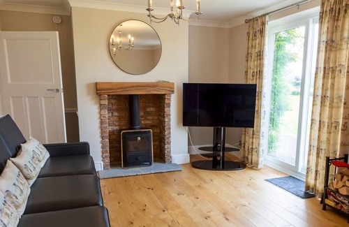 Darlington Cottage | This property is in a stunning location, it boasts a private hot tub and games rooms.