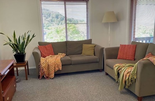 Coffs Harbour Apartment | This unique level home is situated on the upper level in a private setting, with mountain views