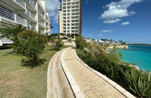 Maho Apartment | Tranquil Oceanside: Pools & Direct Beach Access