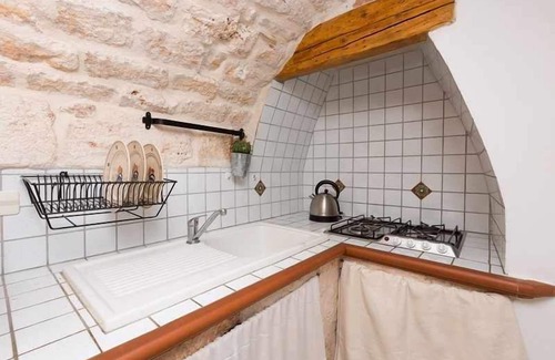San Michele Salentino Villa | Trullo with private pool - garden games - outdoor kitchen - wood-burning oven