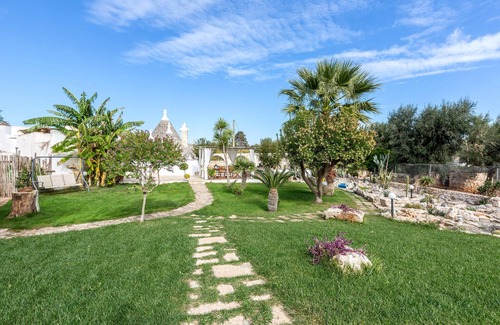 San Michele Salentino Villa | Trullo with private pool - garden games - outdoor kitchen - wood-burning oven