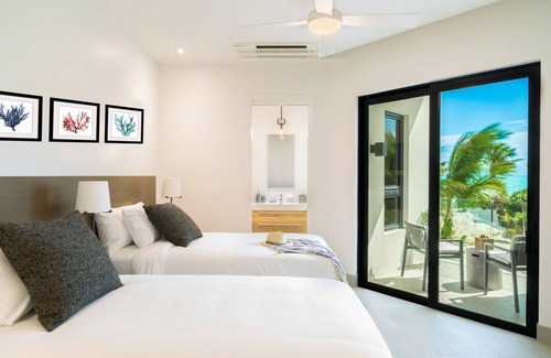 Long Bay Hills Resort | Two bedroom beachfront suite just steps from the beach!