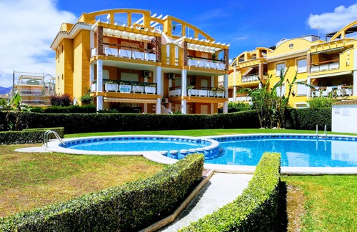 Xeraco Beach Apartment | Two bedrooms on the ground floor, patio with barbecue, swimming pool and tennis court.