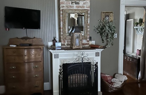 Abbeville House | Two bedrooms with queen beds 2 sofas and a full size pullout sofa. Antique sofa!