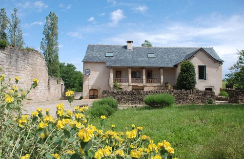 Ginals House | Two houses with a large swimming pool next to the ruins of a medieval castle