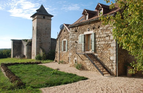 Ginals House | Two houses with a large swimming pool next to the ruins of a medieval castle
