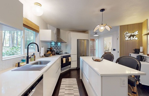 Burley House | Unique waterfront home with sauna, hot tub, and washer & dryer