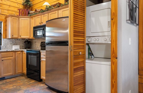 Branson Theater District Cabin | Unwind and Relax! Walk-in Log Cabin with Gas Fireplace and Screened Balcony