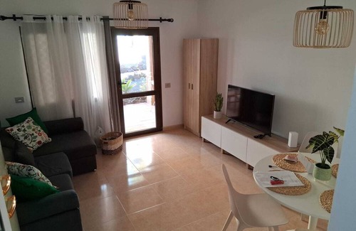 Corralejo Apartment | Vacation 'Ocean Dune' with Shared Pool, Private Terrace and Wi-Fi