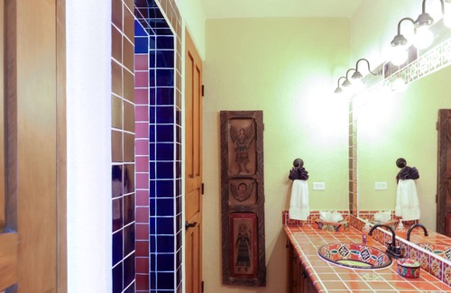 Nopolo House | Vibrant house with golf/ocean views, shared pool, partial AC, WiFi & gas grill!