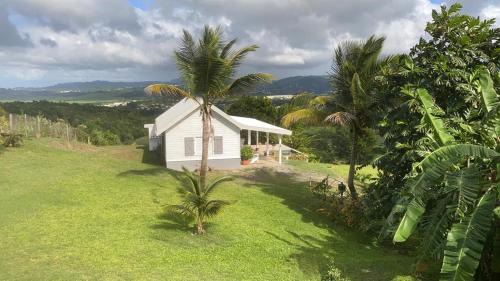Riviere-Salee House | Villa 1 de standing 80m2 avec piscine et vue imprenable sur la mer et sur la campagne