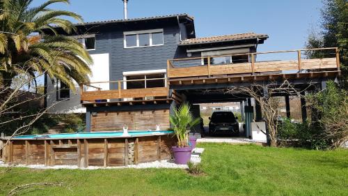 Tarnos Villa | villa bois sur pilotis avec vue sur forêt