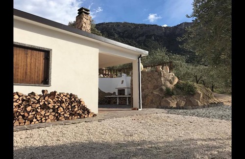 Dorgali Villa | VILLA in Sardinian stone surrounded by greenery. Panoramic terrace, BBQ and relaxation area