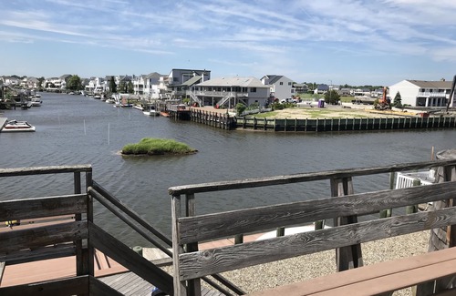 Osborn Island House | Watersports paradise, 65ft floating dock, bay in front, lagoon in back yard