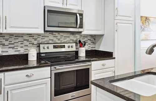 Waters Edge House | Water's Edge 114 - River Daze - Premier Riverfront Townhome - Pool & Fishing Pier!