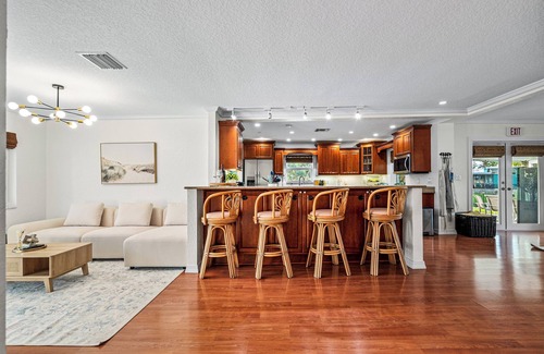 Lake Clarke Shores House | Waterfront Escape with Heated Pool, Mini-Golf, TikiHut in West Palm Beach