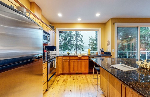 Shelton House | Waterfront home with private hot tub, patio, games, & gym room