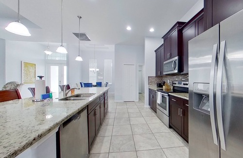 Trafalgar House | Waterfront home with private pool, dock, WiFi, central AC, and desk workspaces