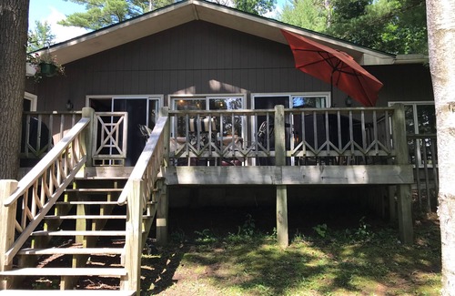 Lac du Flambeau House | Waterfront Lake Lodge with fireplace: Sleeps 10. Pets Ok. Fall Pontoon Specials!