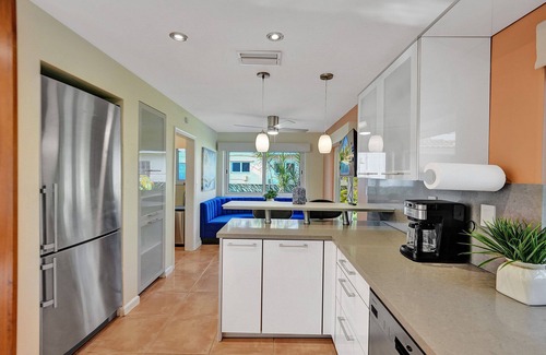 Coral Ridge Isles House | Waterfront Serenity. Pool & BBQ. Koi Pond