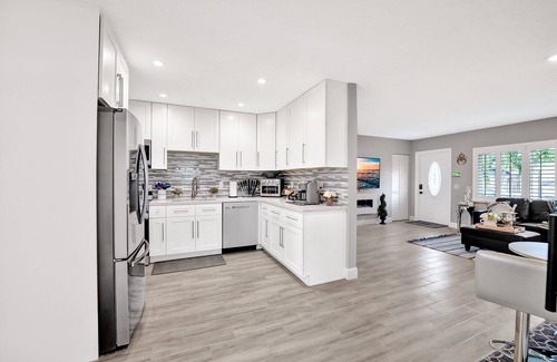 Golfview Harbor House | Waterfront Tropic Oasis: Heated Pool, Pergola, Canal, Dock, Air Hockey!