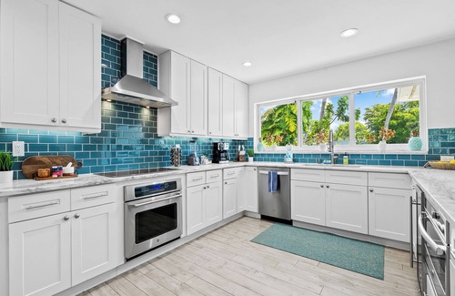 Coral Shores House | Welcome to Pineapple Paradise, A Spacious Modern Tropical Waterway Home!