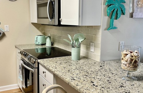 Heron Harbour Isle Condo | Welcome to your SPLASH PAD! Pools, walk to the beach and private courtyard