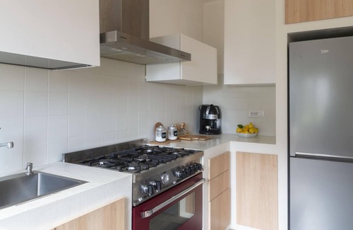 Cala Gonone Apartment | Welcomely - Green and Blue Ground Floor