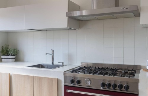 Cala Gonone Apartment | Welcomely - Green and Blue Ground Floor