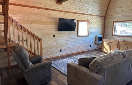 Johnson County Cabin | White cabin in the woods close to Univ. of Central Missouri and Whiteman AF Base