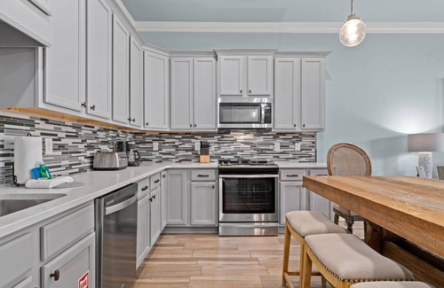 Miramar Beach House | White Coral Chateau with Low-Speed Vehicle, Heated Pool, and Cornhole Field