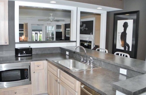Suttons Bay House | White Fence-Exquisite Private Waterfront!