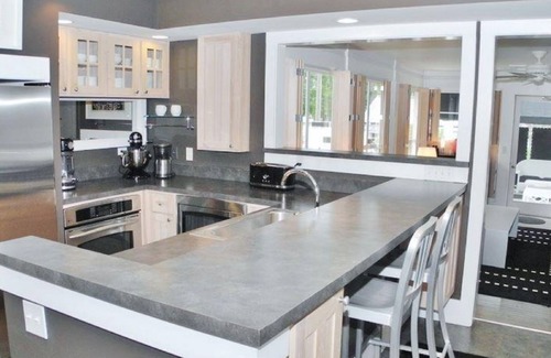 Suttons Bay House | White Fence-Exquisite Private Waterfront!