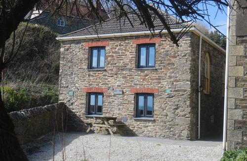 Portholland Cottage | Wonderful reverse level conversion located on the sea front in picturesque rural hamlet on the South