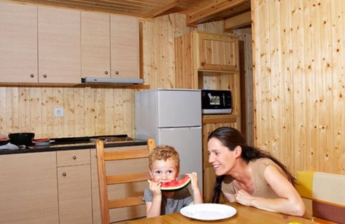 Santa Susanna Ski Chalet | Wooden chalet with a nice covered terrace, near the beach