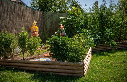 San Brizio Apartment | Wooden house with porch and garden