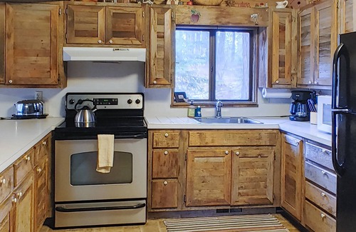 McCall Cabin | Woodland cabin with screened porch & meadow views - near town, with internet