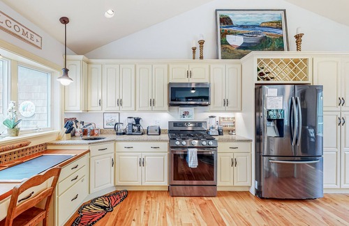 Boothbay House | Woodland hideaway with lake access, private game room, fireplace, & luxe kitchen
