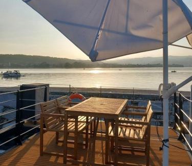 Quartiere XXIV Don Bosco Boat Rental | Yellow houseboat on Lake Maggiore