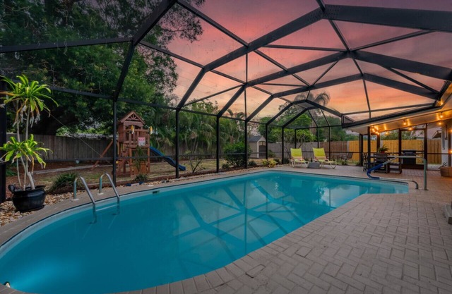 3BR/2BA Pet & Kid-Friendly Oasis w Heated Pool, Swingset, Game Rm, Near Beach